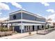 Charming two-story marketplace with a coffee shop and brewery, featuring outdoor seating and attractive signage at 2879 Shadow Lake Rd, Lafayette, CO 80026