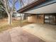 Covered patio and spacious backyard with mature trees at 385 32Nd St, Boulder, CO 80305