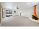 Spacious living room showcasing a mid-century modern fireplace and view of backyard at 385 32Nd St, Boulder, CO 80305