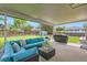 Covered backyard patio with outdoor furniture and a grill, perfect for entertaining at 10826 Claire Ln, Northglenn, CO 80234
