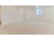 Spacious carpeted basement with white walls and a window providing natural light at 10826 Claire Ln, Northglenn, CO 80234