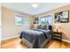 Inviting bedroom with hardwood floors, and large windows at 10826 Claire Ln, Northglenn, CO 80234