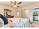 A bright main bedroom with a view to the attached bathroom at 10826 Claire Ln, Northglenn, CO 80234