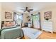 Second bedroom with a desk area, large windows, and plenty of natural light at 10826 Claire Ln, Northglenn, CO 80234