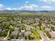 Picturesque aerial view of a community nestled amidst lush greenery, offering a tranquil and inviting atmosphere at 16753 W 61St Ln, Golden, CO 80403