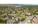 Aerial view of a well-maintained community with tree-lined streets, showcasing a serene and attractive neighborhood at 16753 W 61St Ln, Golden, CO 80403