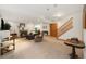 Finished basement with cozy fireplace, pool table, and a staircase to the upper level at 16753 W 61St Ln, Golden, CO 80403