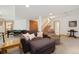 Finished basement with billiard table, comfortable furnishings, and a staircase at 16753 W 61St Ln, Golden, CO 80403