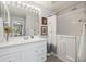 Bathroom with updated vanity, sink, walk in bathtub and flooring at 16753 W 61St Ln, Golden, CO 80403
