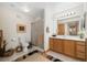 Light bathroom with vanity, shower, tiled floor, and tasteful decor at 16753 W 61St Ln, Golden, CO 80403