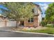 Charming home featuring mature landscaping with a lush green lawn and mature tree at 16753 W 61St Ln, Golden, CO 80403