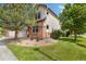 Well-maintained home with a lush green lawn and mature trees at 16753 W 61St Ln, Golden, CO 80403