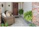 Inviting front porch with cozy seating and decorative wreath, offering a warm welcome at 16753 W 61St Ln, Golden, CO 80403