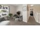 Inviting hallway featuring cozy beanbag chairs, plants, and access to a bedroom at 16753 W 61St Ln, Golden, CO 80403