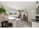 Updated kitchen with stainless steel appliances, light countertops, bar seating and a view of the outdoors at 16753 W 61St Ln, Golden, CO 80403