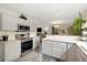Updated kitchen with stainless steel appliances, light countertops, and an open concept design at 16753 W 61St Ln, Golden, CO 80403