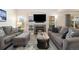 Comfortable living room with a fireplace, built-in shelving, and a large window at 16753 W 61St Ln, Golden, CO 80403