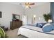 Primary bedroom with vaulted ceiling, light walls and an en-suite bathroom at 16753 W 61St Ln, Golden, CO 80403