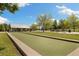 Park featuring a covered pavilion, bocce court, playground, and plenty of green space for outdoor activities at 16753 W 61St Ln, Golden, CO 80403