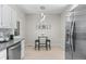 Cozy dining area with modern light fixture, breakfast table, and seating at 10693 W 63Rd Dr # 106, Arvada, CO 80004