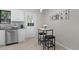 Dining area with view of the backyard, stylish breakfast table and seating at 10693 W 63Rd Dr # 106, Arvada, CO 80004