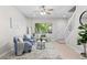 Inviting living room with large window, comfortable seating, and natural light at 10693 W 63Rd Dr # 106, Arvada, CO 80004