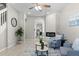 Cozy living room with modern fireplace, comfortable seating, and open to dining area at 10693 W 63Rd Dr # 106, Arvada, CO 80004