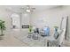 Bright living room featuring a modern fireplace, neutral color palette, and cozy seating at 10693 W 63Rd Dr # 106, Arvada, CO 80004