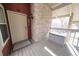 Private entrance with wooden deck, brick wall, and storage at 2686 E Otero Pl # 12, Centennial, CO 80122
