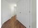 Bright hallway with wood flooring and neutral walls at 2686 E Otero Pl # 12, Centennial, CO 80122
