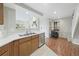 Galley kitchen with stainless steel appliances and wood cabinets at 2686 E Otero Pl # 12, Centennial, CO 80122