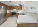 Open concept kitchen with stainless steel appliances and white countertops at 2686 E Otero Pl # 12, Centennial, CO 80122
