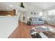 Bright living room with hardwood floors, comfy couch, and large window at 2686 E Otero Pl # 12, Centennial, CO 80122