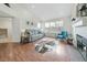 Spacious living room with hardwood floors, fireplace, and large windows at 2686 E Otero Pl # 12, Centennial, CO 80122