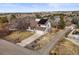 Charming two-story home with solar panels, a spacious driveway, and mature trees in a quiet neighborhood at 6770 Ridgeway Cir, Parker, CO 80134