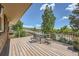 Spacious deck with a table, chairs and expansive views at 11410 W 72Nd Pl, Arvada, CO 80005