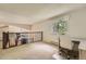 Upstairs bonus room featuring a desk area and overlooking the kitchen at 11410 W 72Nd Pl, Arvada, CO 80005
