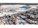 Aerial neighborhood view with red indicator highlighting the subject home, and frozen lake in distance at 1683 N Zenobia St, Denver, CO 80204