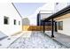 Landscaped backyard with partial snow covering, enclosed by a wooden fence at 1683 N Zenobia St, Denver, CO 80204
