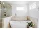 Elegant bathroom with a freestanding tub, glass-enclosed shower, and stylish fixtures at 1683 N Zenobia St, Denver, CO 80204