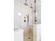 Luxurious shower with dual shower heads and tiled bench at 1683 N Zenobia St, Denver, CO 80204