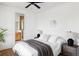 Cozy bedroom with a comfortable bed, modern decor, and an attached bathroom at 1683 N Zenobia St, Denver, CO 80204