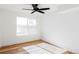 Bright bedroom featuring a ceiling fan and gleaming hardwood floors at 1683 N Zenobia St, Denver, CO 80204