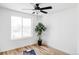 Bright bedroom with a large window, hardwood floors, and a modern ceiling fan at 1683 N Zenobia St, Denver, CO 80204