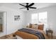 Cozy bedroom featuring a large window and hardwood floors at 1683 N Zenobia St, Denver, CO 80204
