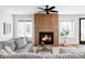 Inviting living room with modern fireplace, stylish decor, and comfortable seating arrangement at 1683 N Zenobia St, Denver, CO 80204