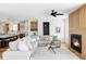 Spacious living room with hardwood floors, a comfortable sectional sofa, and an inviting fireplace at 1683 N Zenobia St, Denver, CO 80204