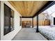 Covered patio featuring wood ceiling, outdoor kitchen, and black metal structural supports at 1683 N Zenobia St, Denver, CO 80204