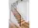 Modern staircase with wood treads and sleek black railing at 1683 N Zenobia St, Denver, CO 80204
