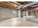 Unfinished basement with concrete floor and exposed ceiling at 821 S 34Th Ave, Brighton, CO 80601
